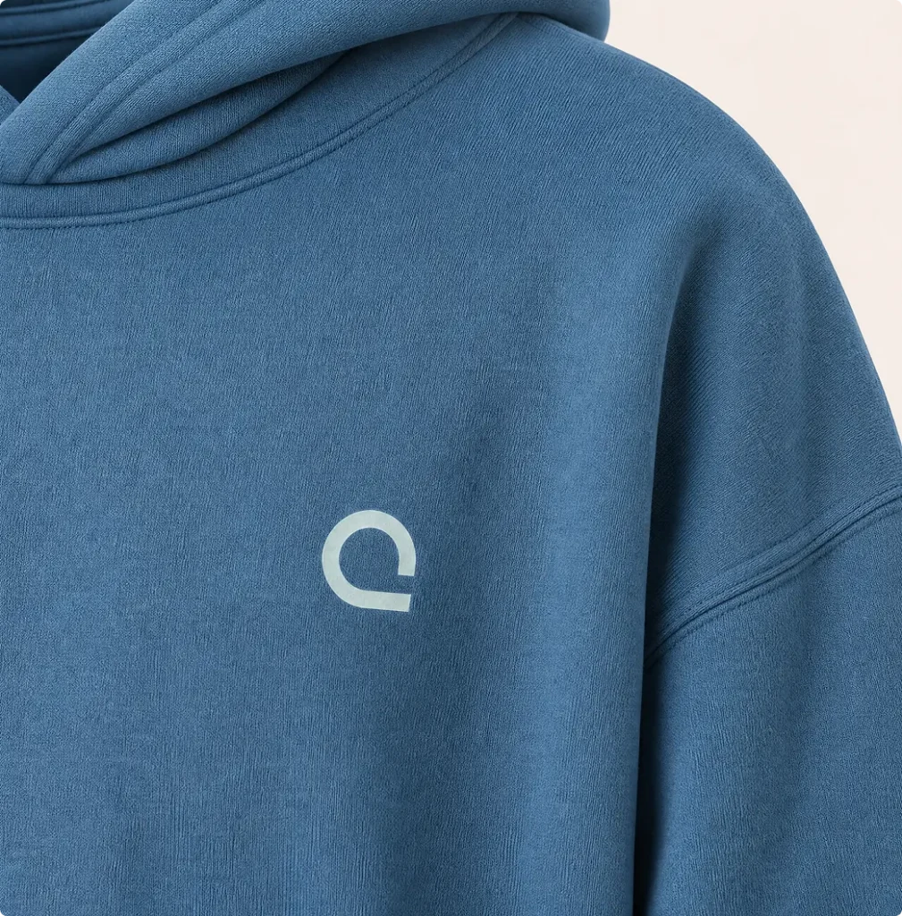 Close-up of blue Zoreilles hoodie with white isotope logo