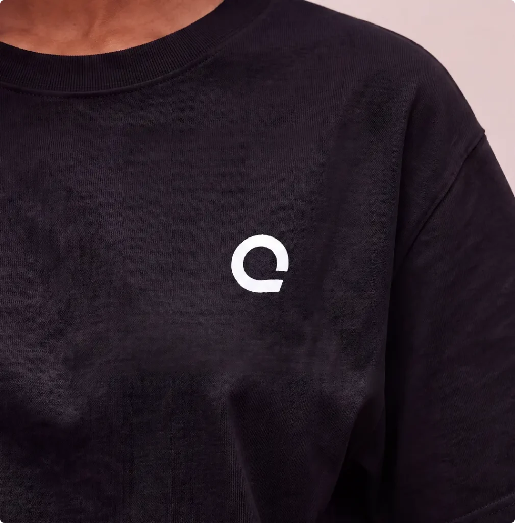 Close-up of black Zoreilles T-shirt with white isotope logo
