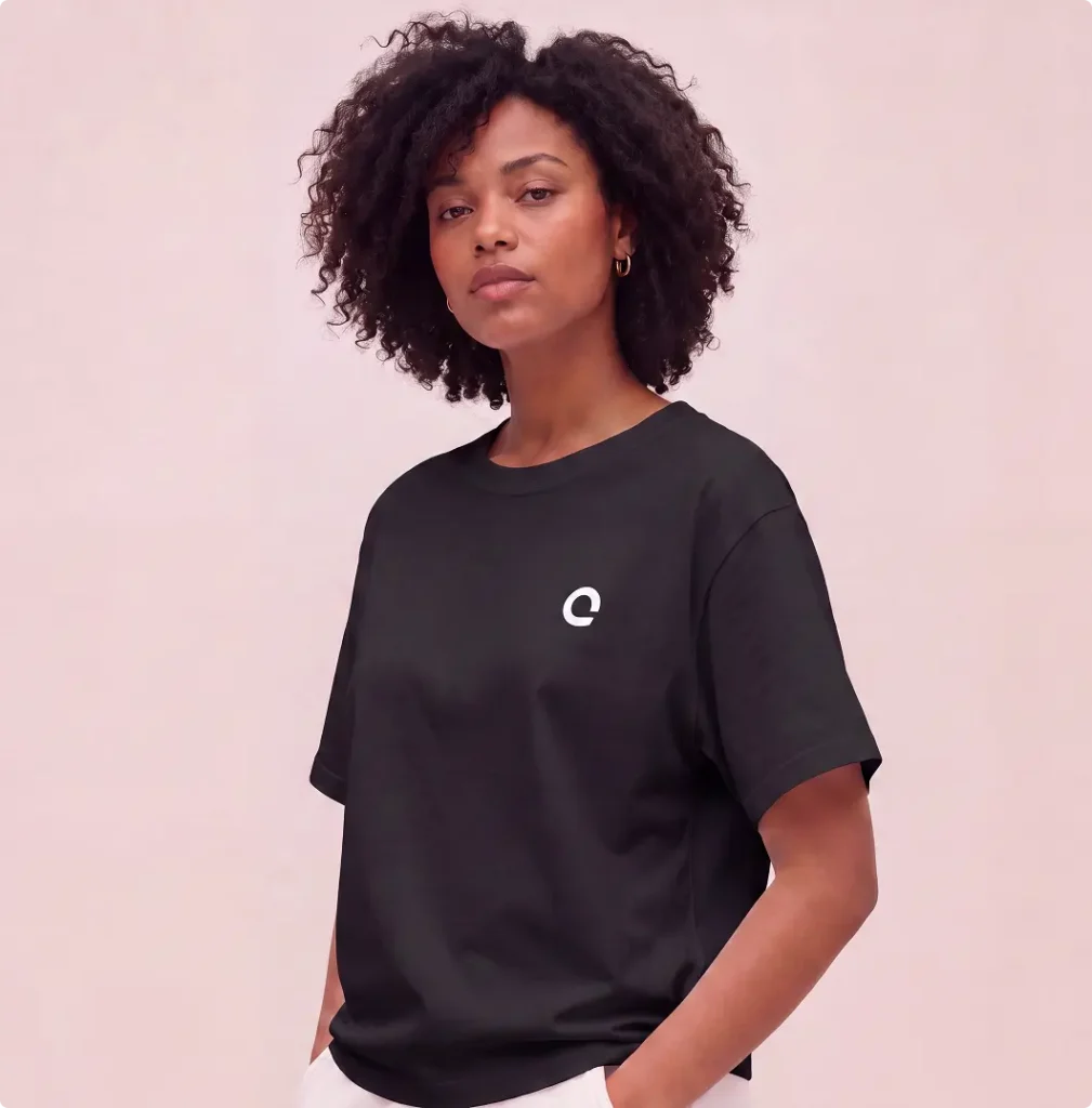 Model wearing black Zoreilles T-shirt with white isotope logo